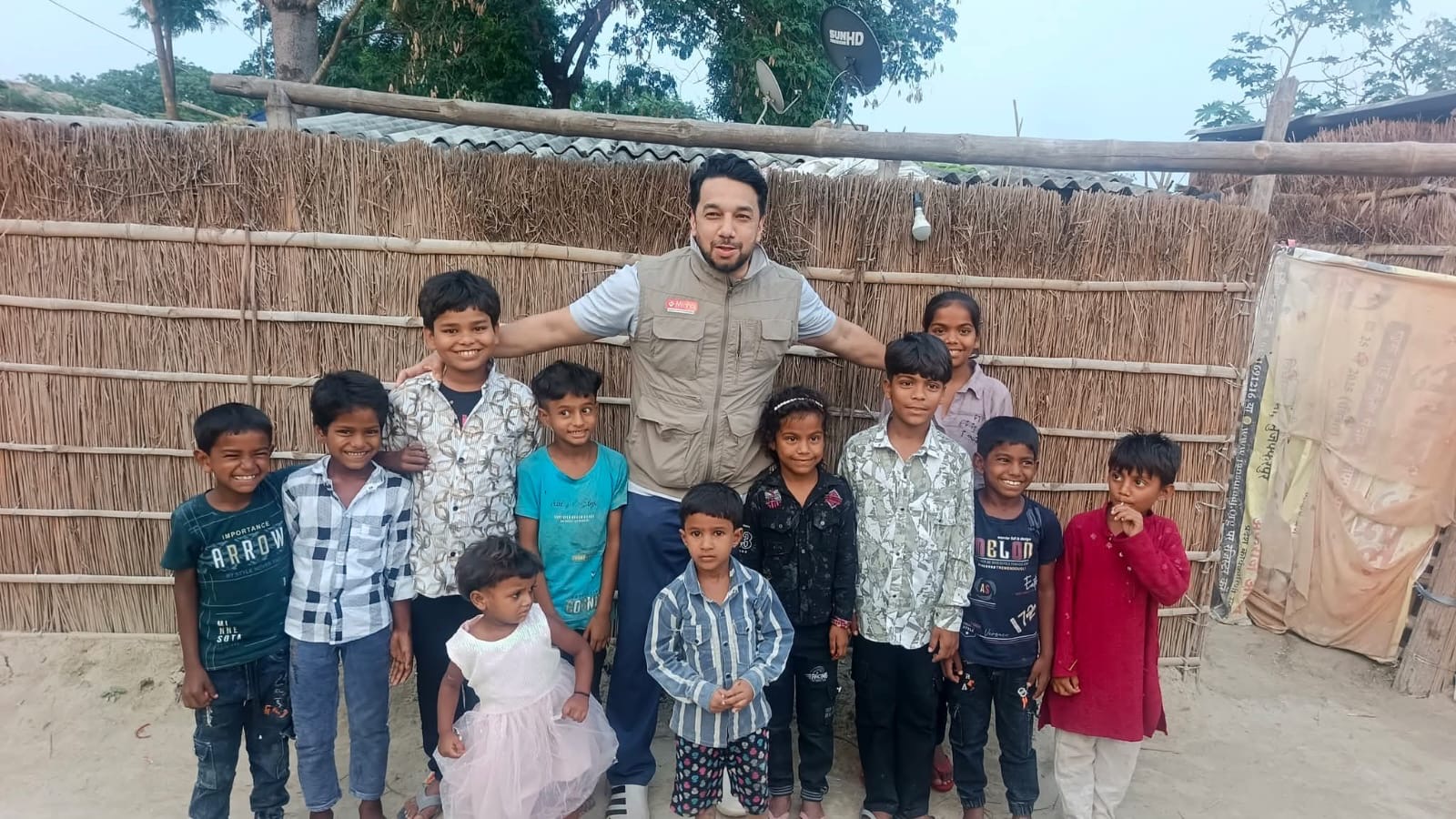 Syed Najam with children during a community visit in India